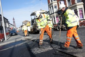 Kier highways workers laying tarmac