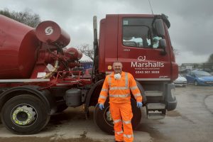 Graham-Smith-Marshalls-plant-manager-working-on-screed-for-hospital-300x200.jpg