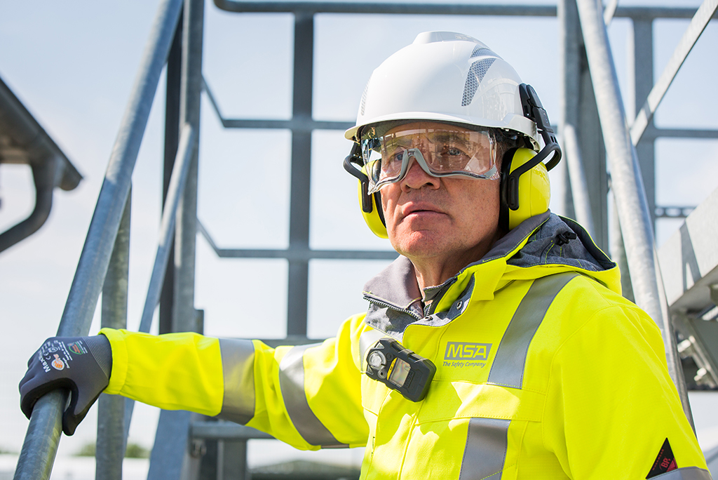 Worker on site in high vis jacket and hard hat